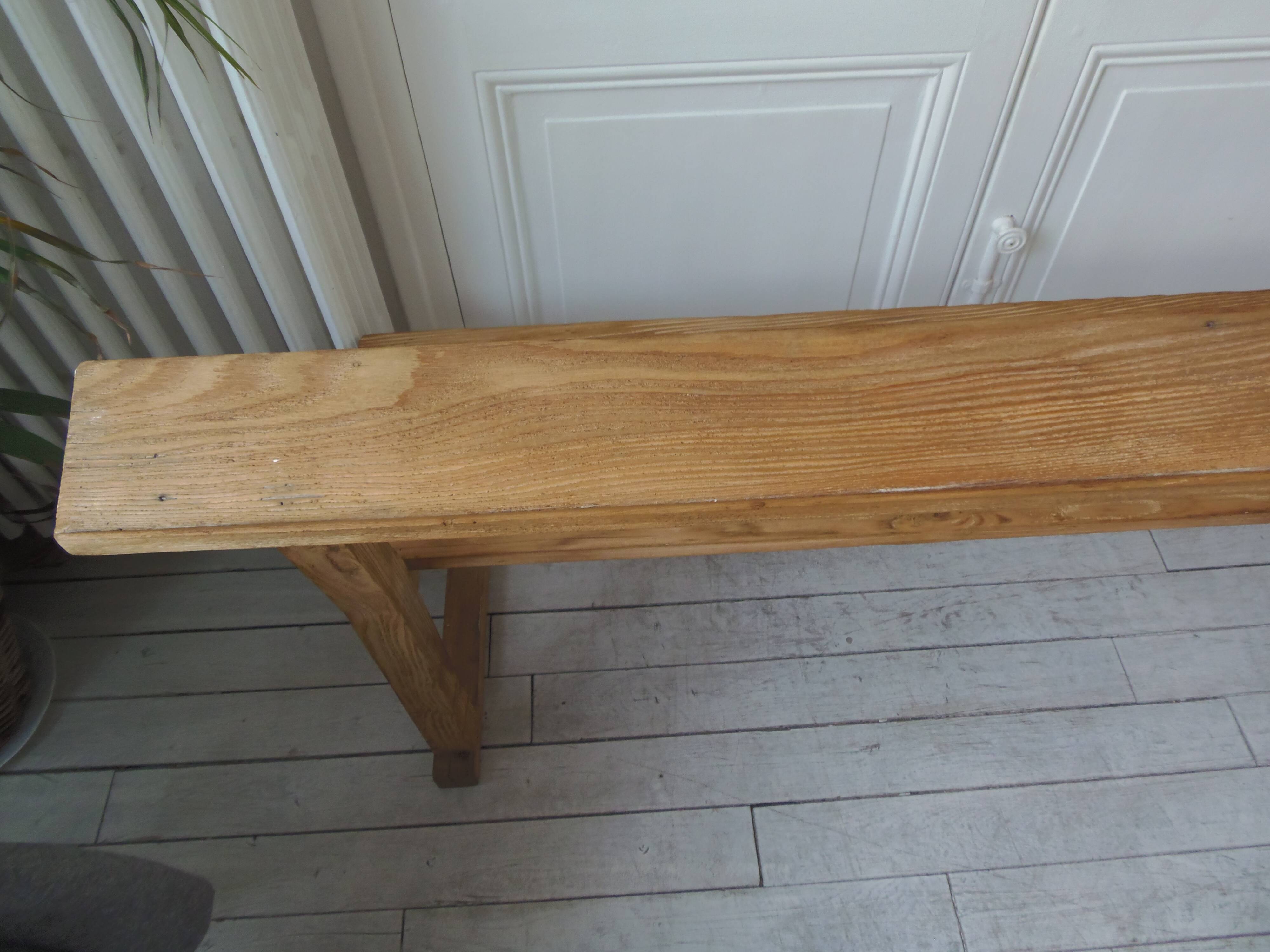 Church bench, bed end in pitch pine with light oak wax finish.