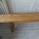 Church bench, bed end in pitch pine with light oak wax finish.