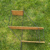 Wall shelf made of rattan and wrought iron