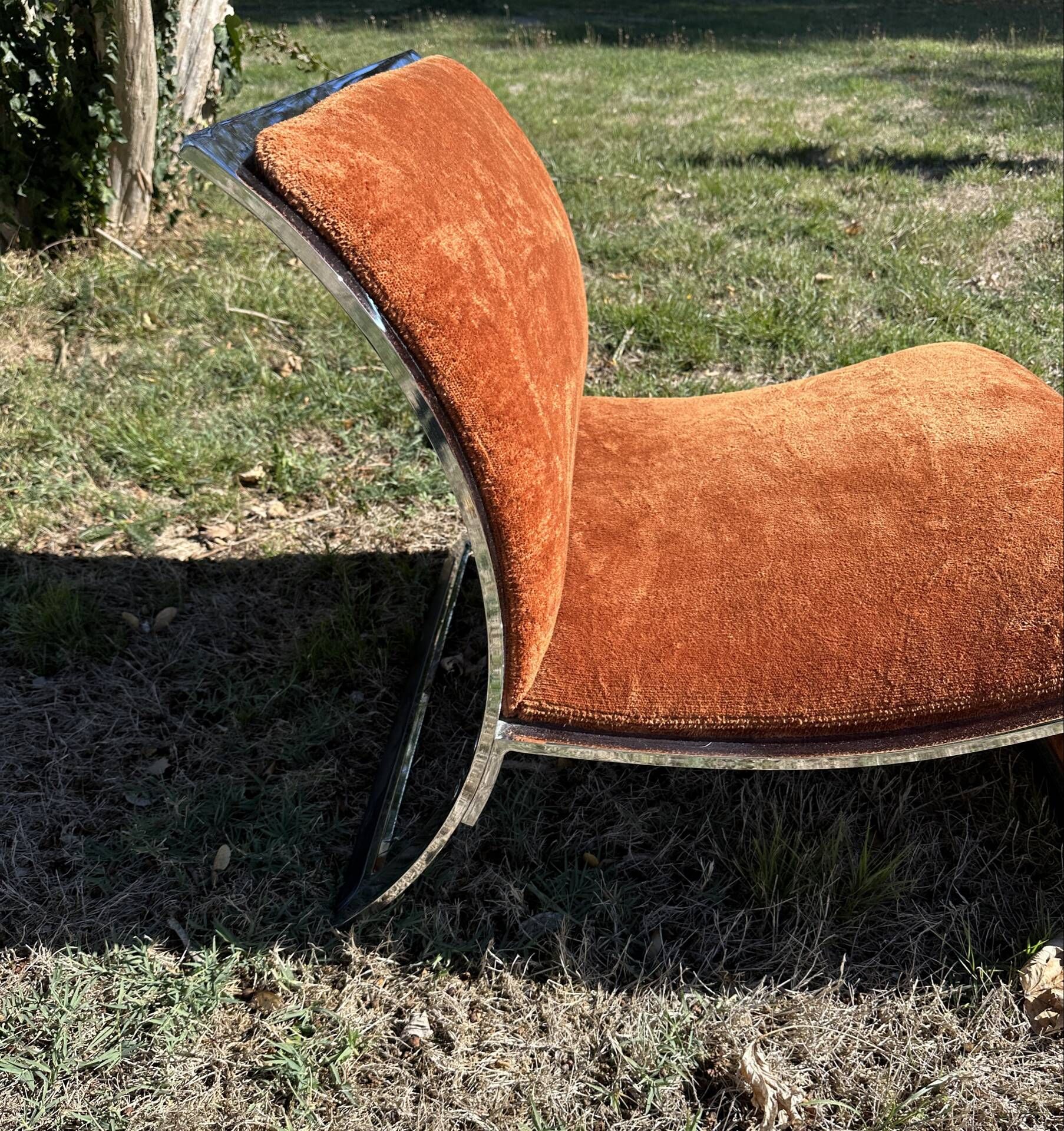 Chrome steel armchair and orange fabric by Vittorio Introini