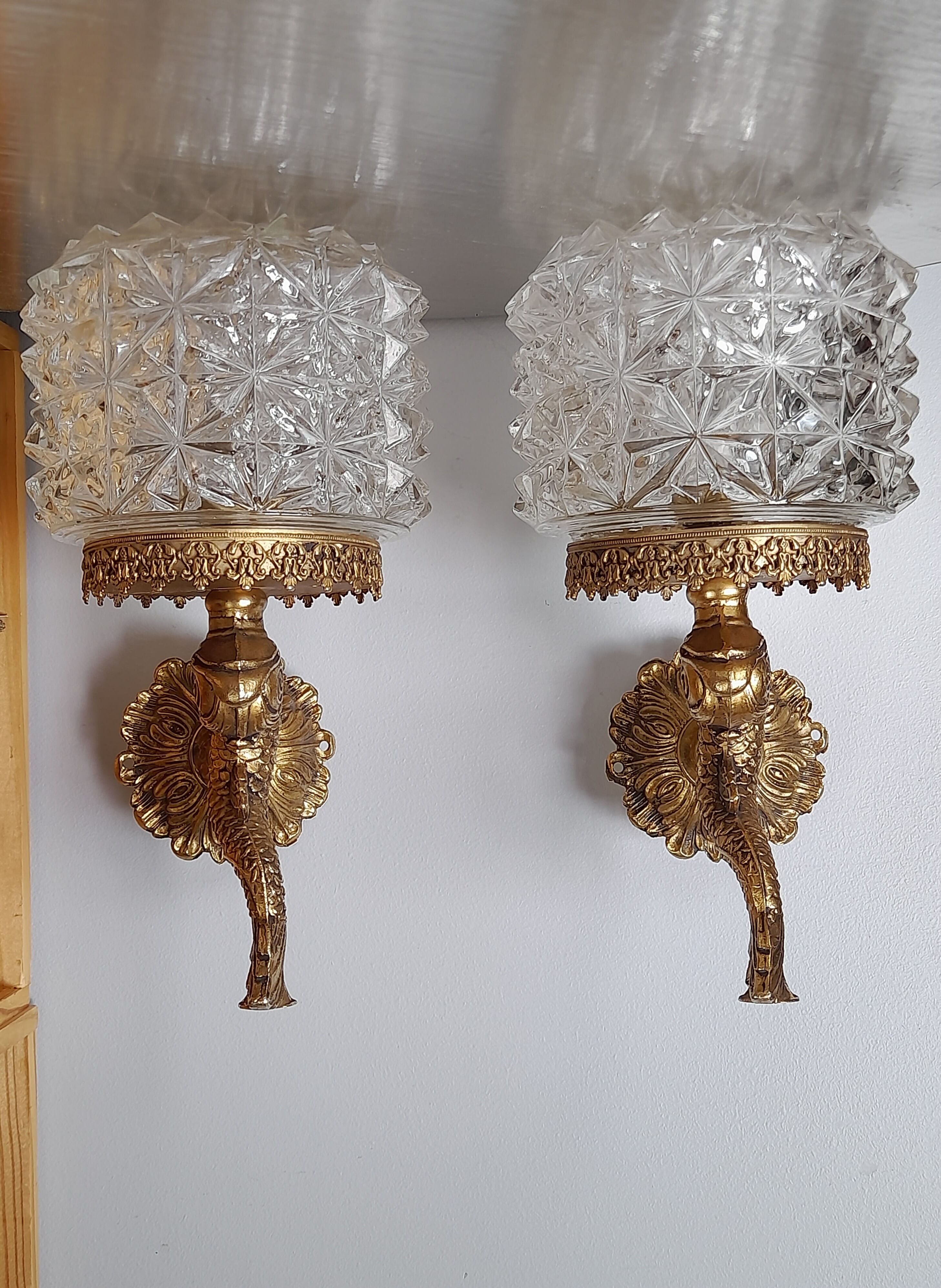 Pair of dolphin brass sconces