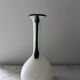 Single flower vase in white and black opaline