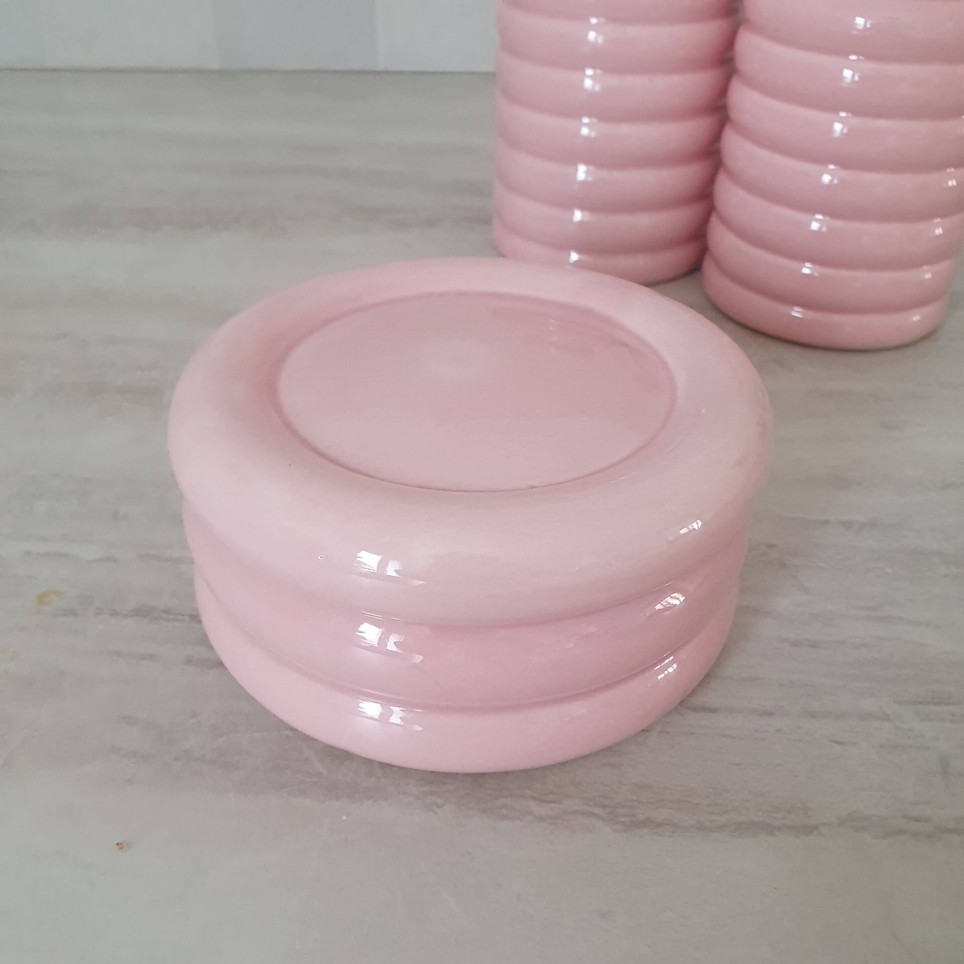 Set of pink and gold ceramic bathroom accessories