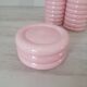 Set of pink and gold ceramic bathroom accessories