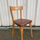 Chaise Baumann assise skaï
