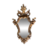 Antique scalloped mirror with pediment decorated with cherubs – carved gilded wood