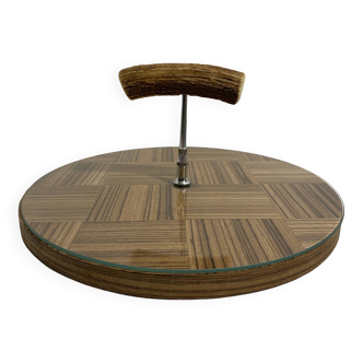 Vintage round wooden cheese board covered with glass plate with foldable handle