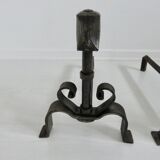 Pair of ironwork andirons in the style of Raymond Subes, circa 1940