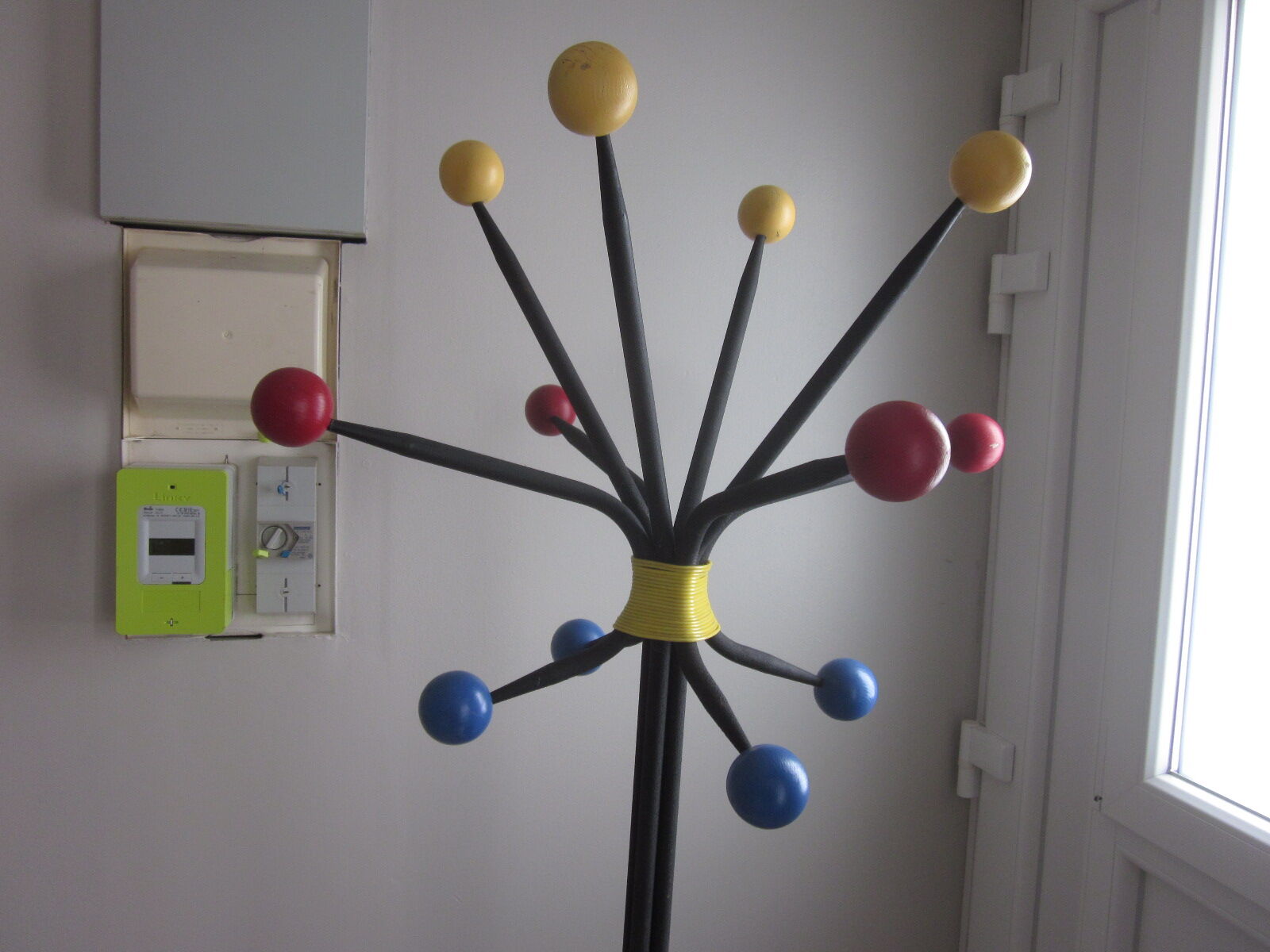 Vintage coat holder has 12 balls