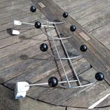 Coat rack that hangs at the top of a door