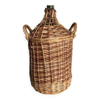 Give me a cylindrical jar with its wicker.