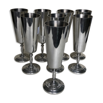 Set of eight silver metal flutes