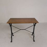 Bistro table with an oak top on a cast iron base, 1930s.