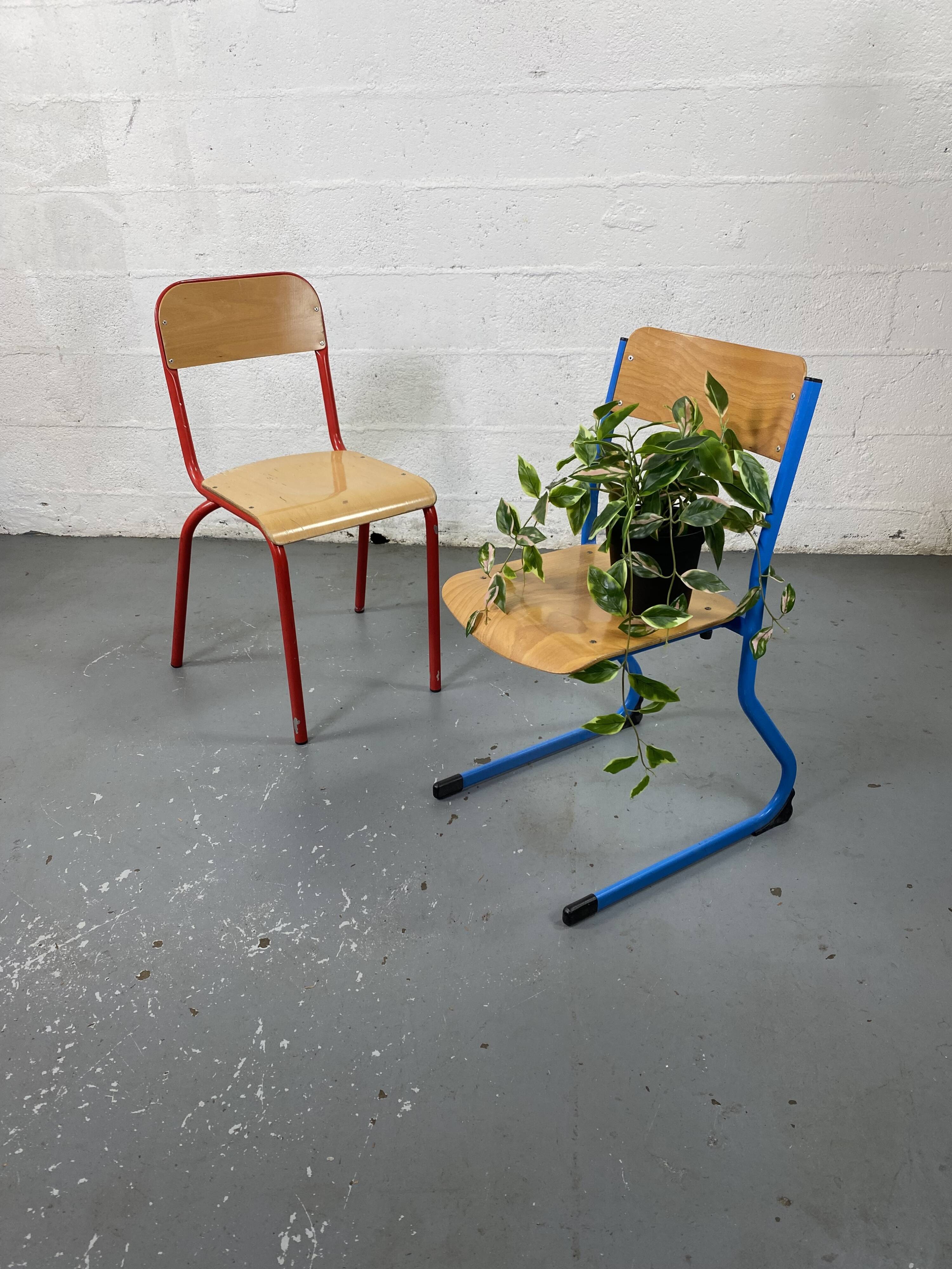 Set of 2 mismatched industrial school chairs