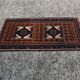 Vintage Persian Baluch rug, hand-knotted wool, 1970.