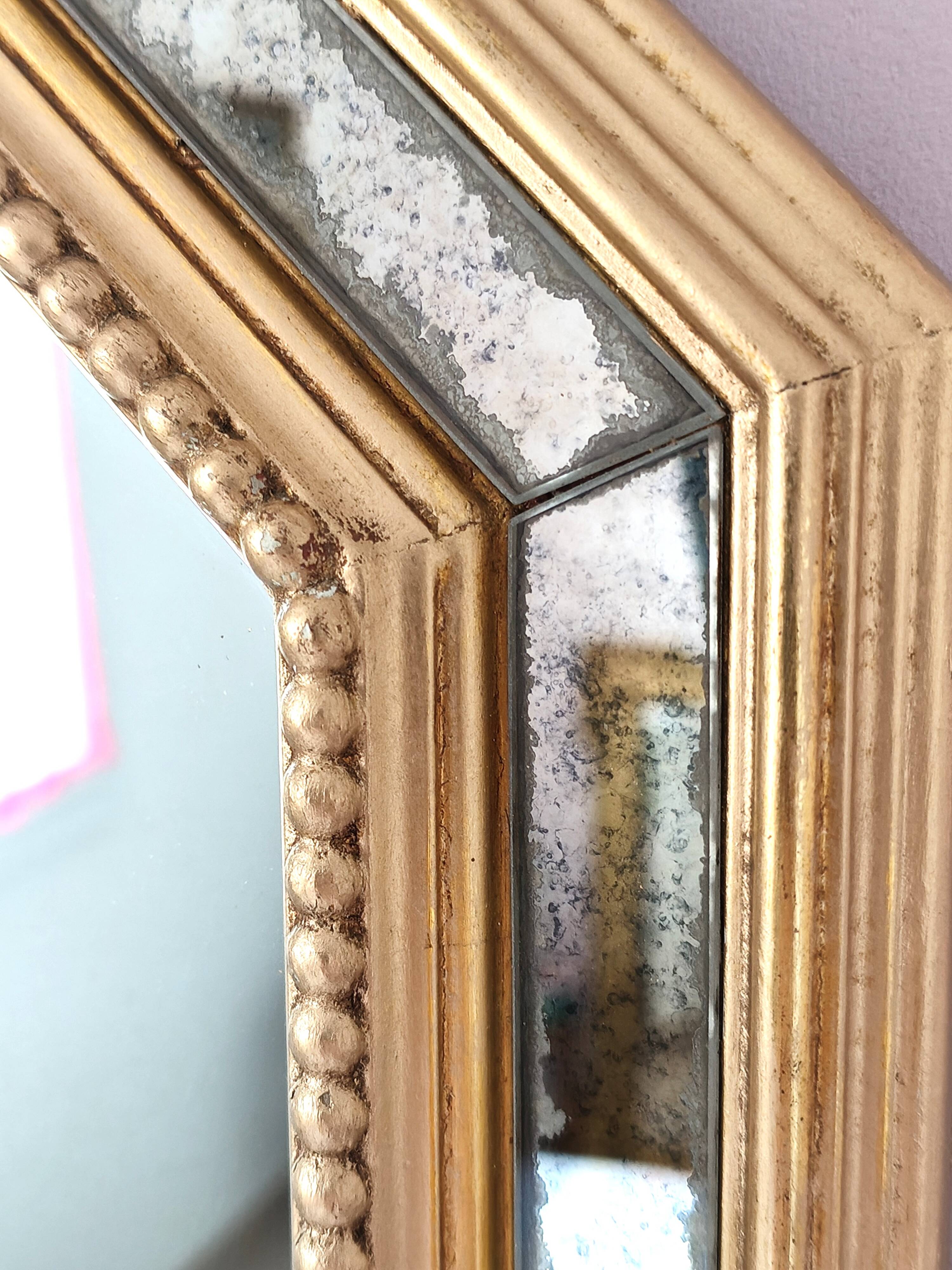 Antique mirror with gilded wooden frame.
