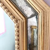 Antique mirror with gilded wooden frame.