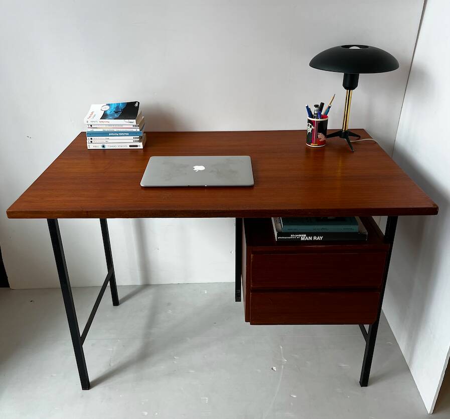 Vintage wooden and metal desk in modernist style.