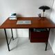 Vintage wooden and metal desk in modernist style.