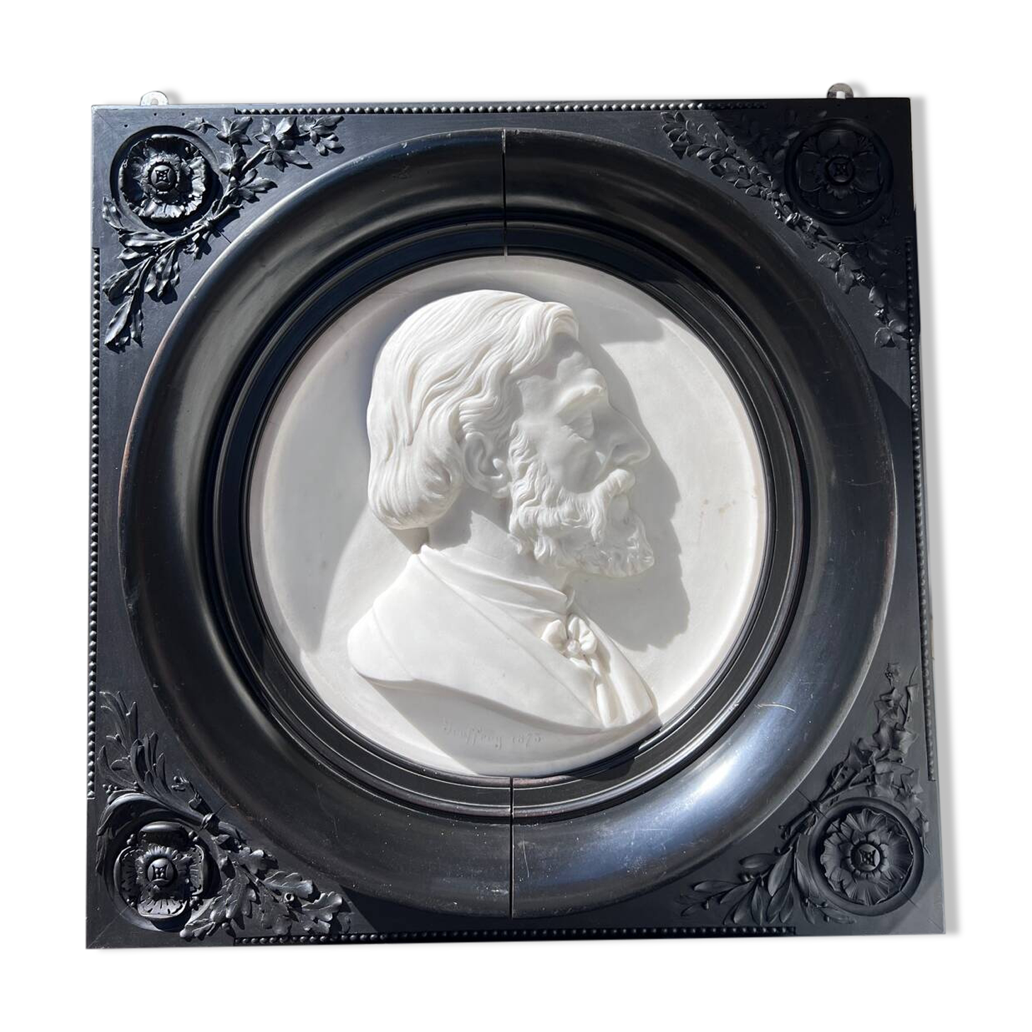 Bas-relief in marble and carved ebony signed Jouffroy, 1873