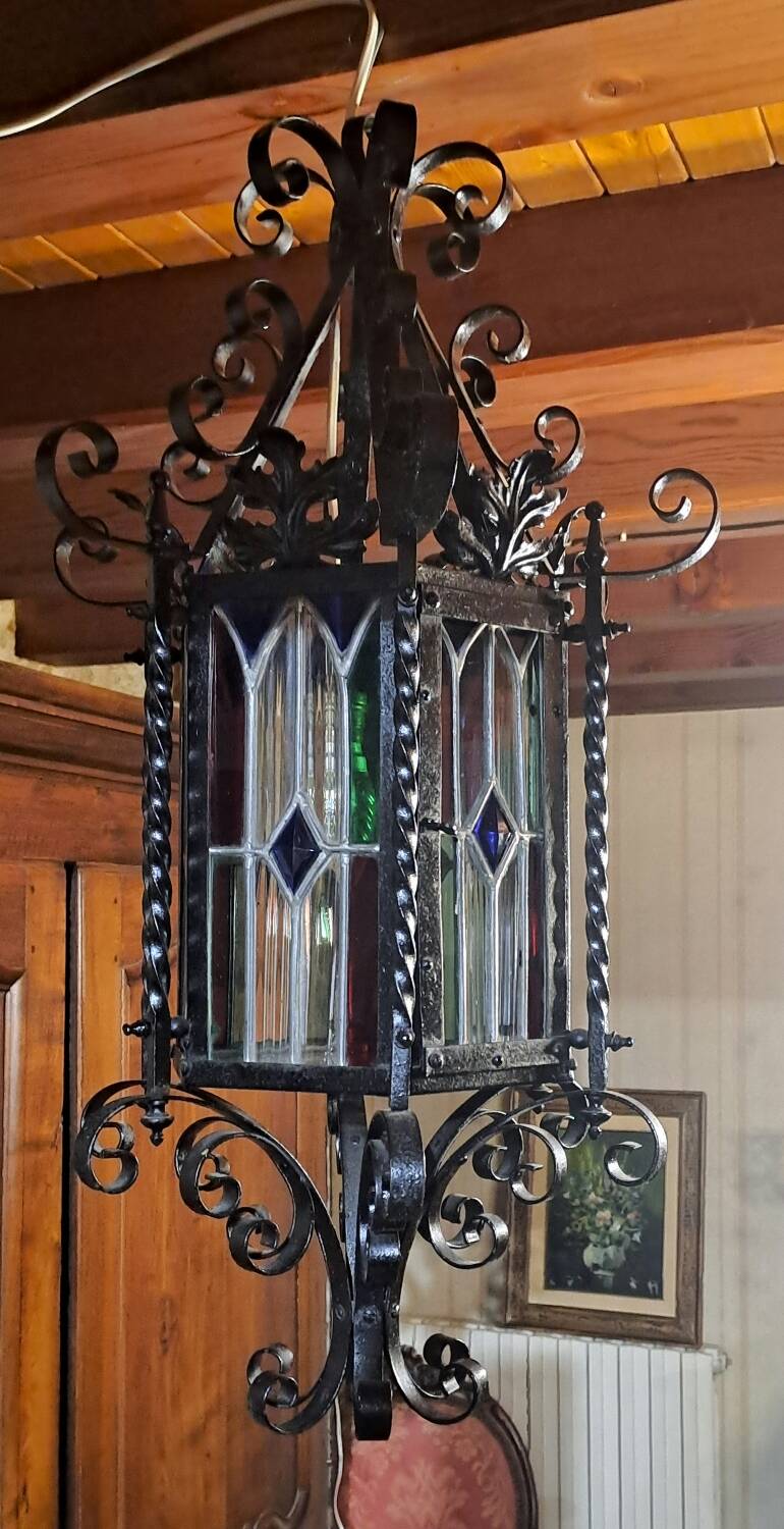 Wrought iron lantern with colored stained glass