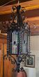 Wrought iron lantern with colored stained glass