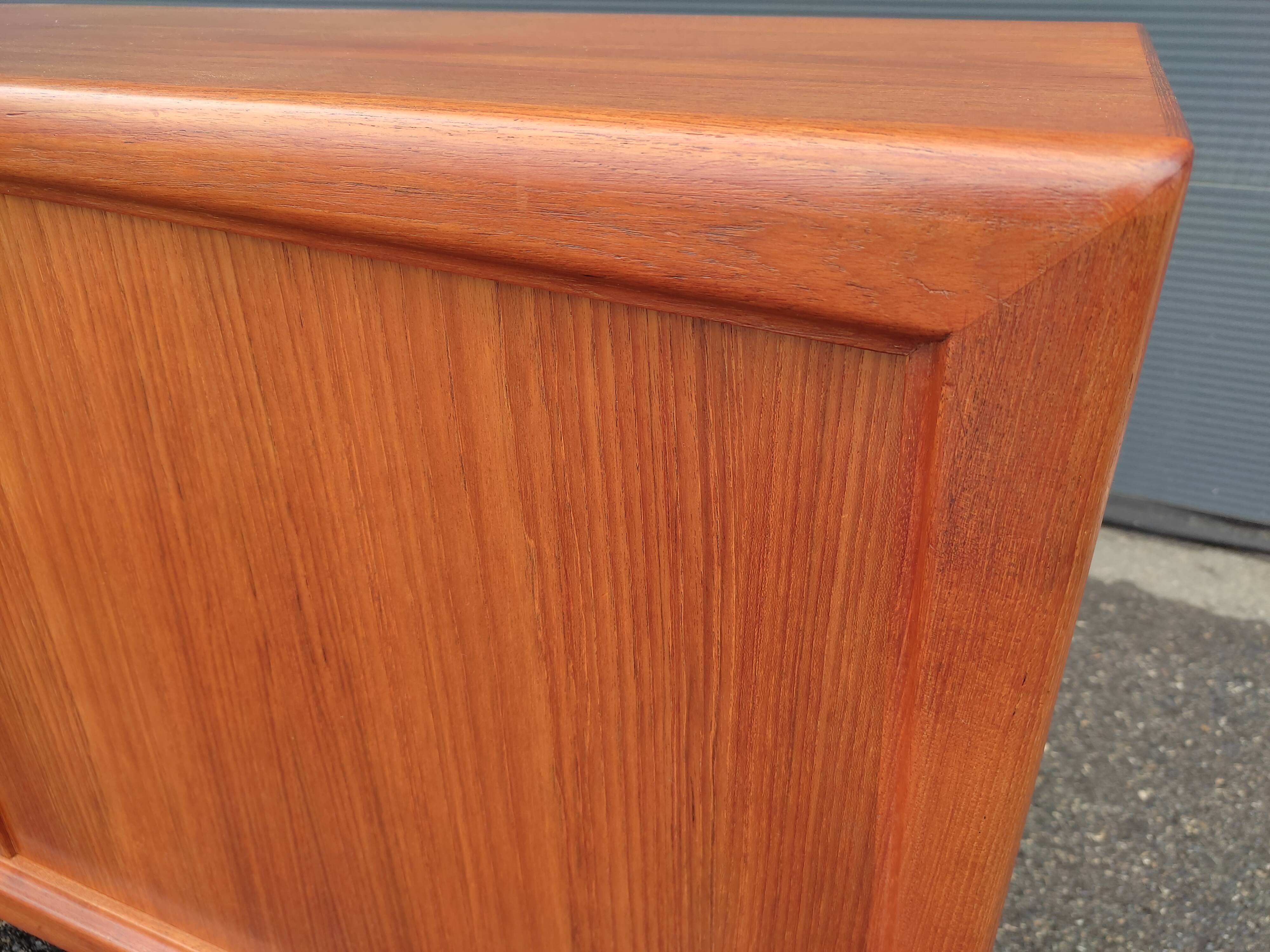 Scandinavian teak row by Axel Christensen for ACO Mobler