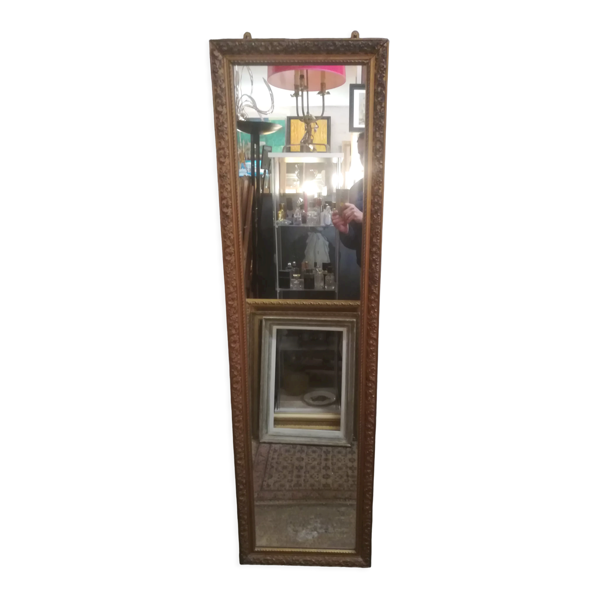 High and narrow mirror in gilded stucco late nineteenth century