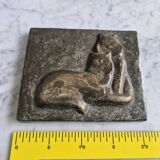 Bas-relief plaque of a rabbit in brown patina, seated cat