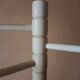 Bath towel rack in white wood, three bars.