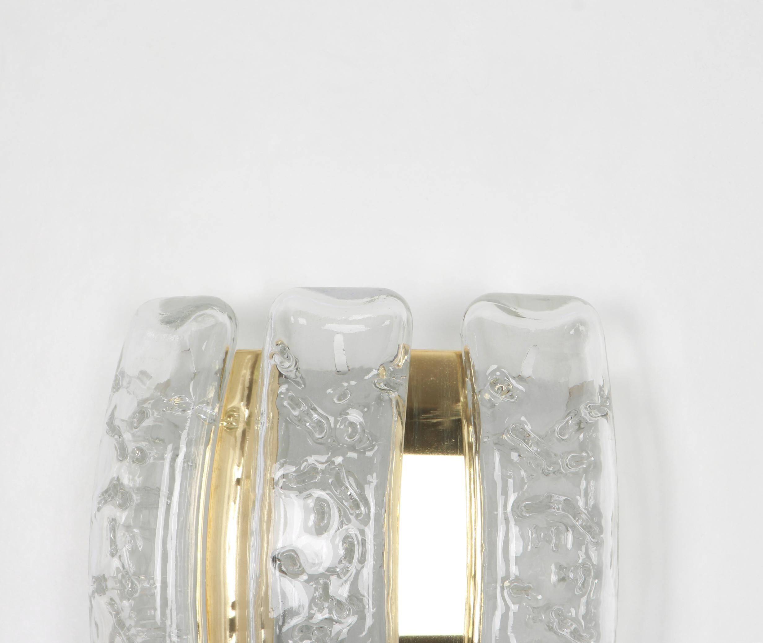Pair of wall sconces in brass or ice glass by Doria, Germany, 1960s.
