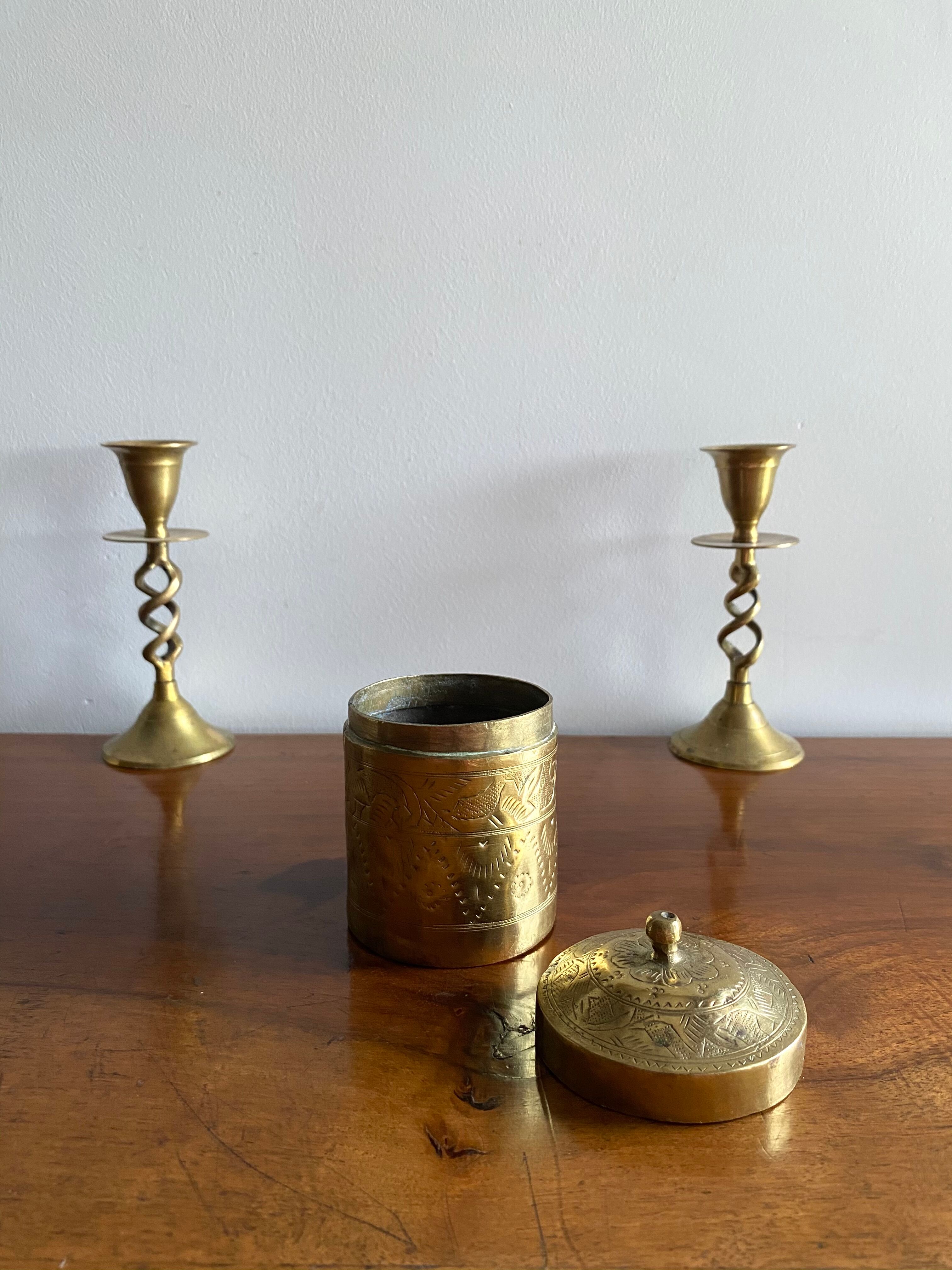 Old round box in chiseled brass