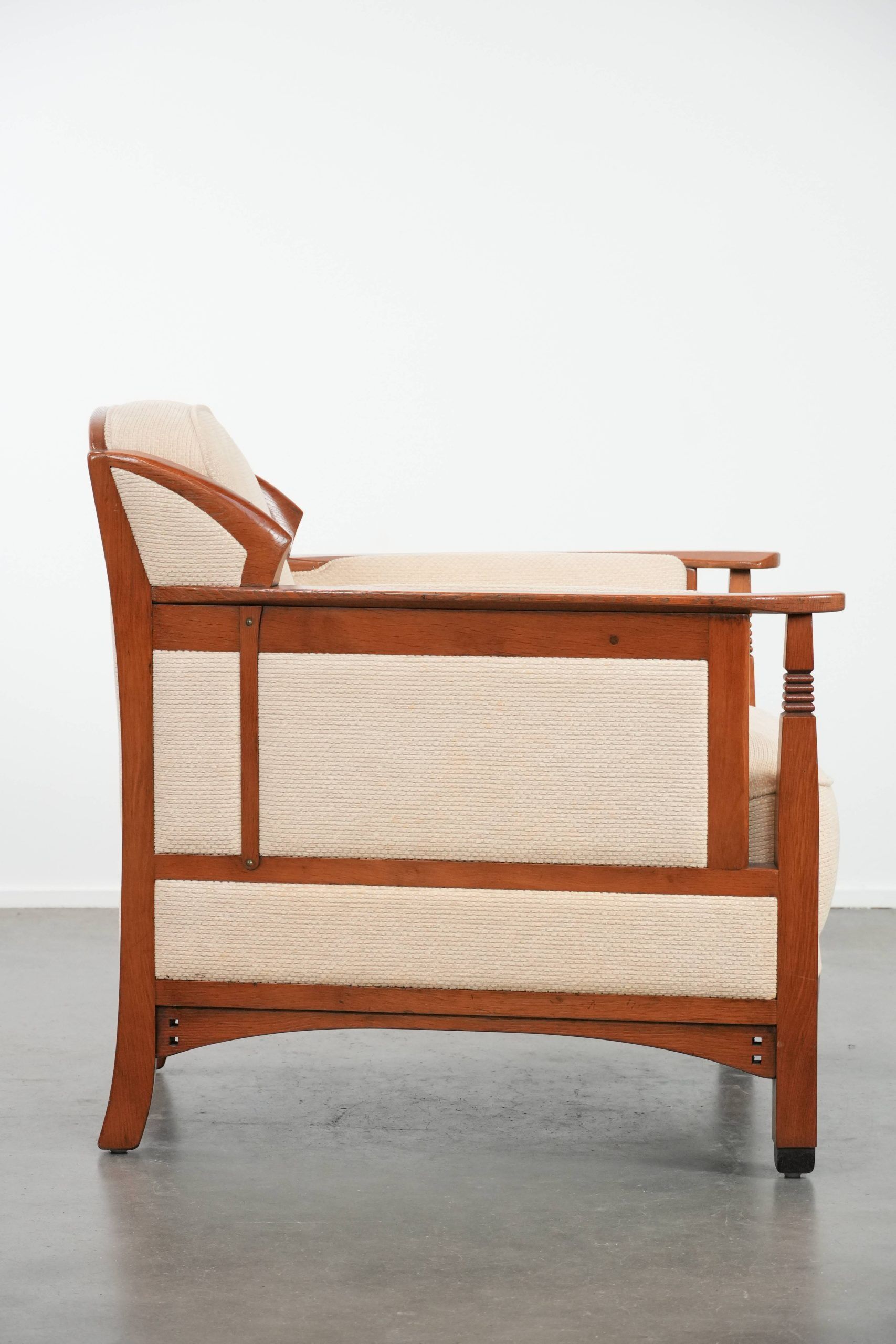 Art Nouveau design armchair with a luxurious light fabric upholstery