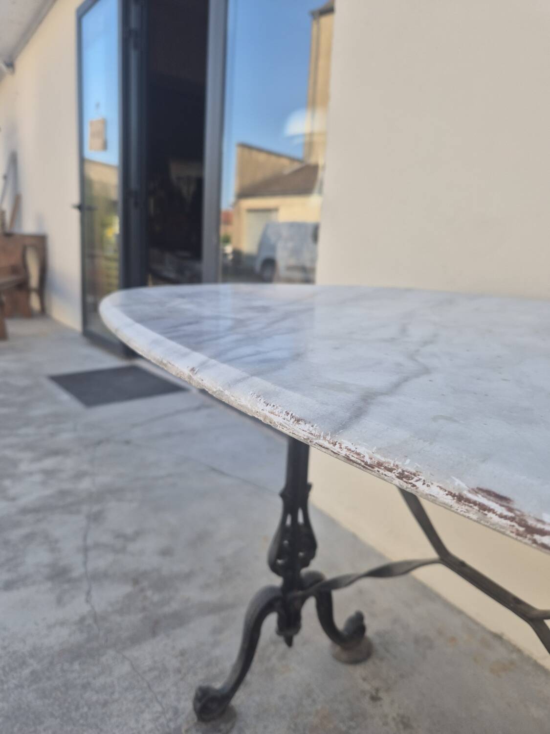 Antique cast iron and marble bistro restaurant table