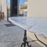 Antique cast iron and marble bistro restaurant table