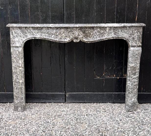 Louis XV fireplace in grey Saint Anne marble, 18th century.