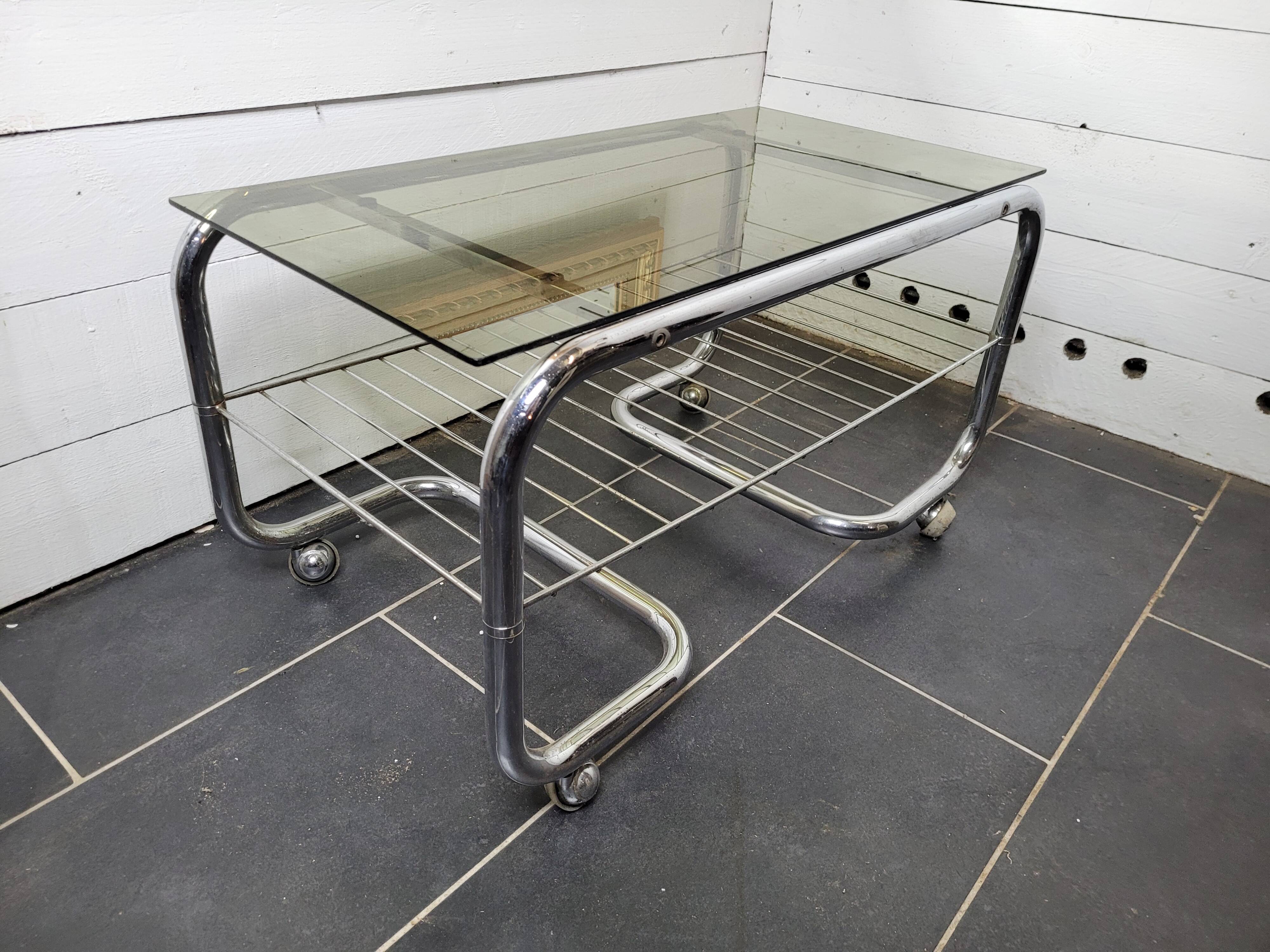 Coffee table with chrome base and smoked glass from the 70s