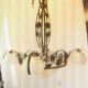 four-armed wrought iron chandelier from the "Art Deco" period (1925)