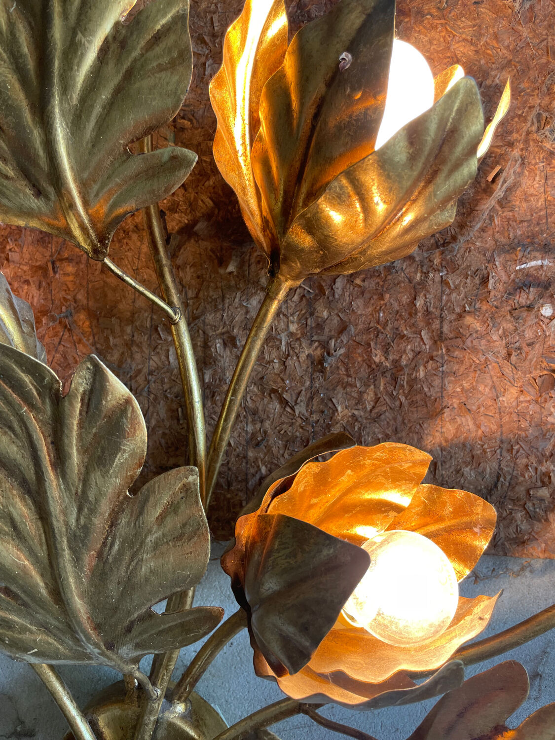 Golden wall lamp foliage