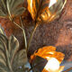 Golden wall lamp foliage