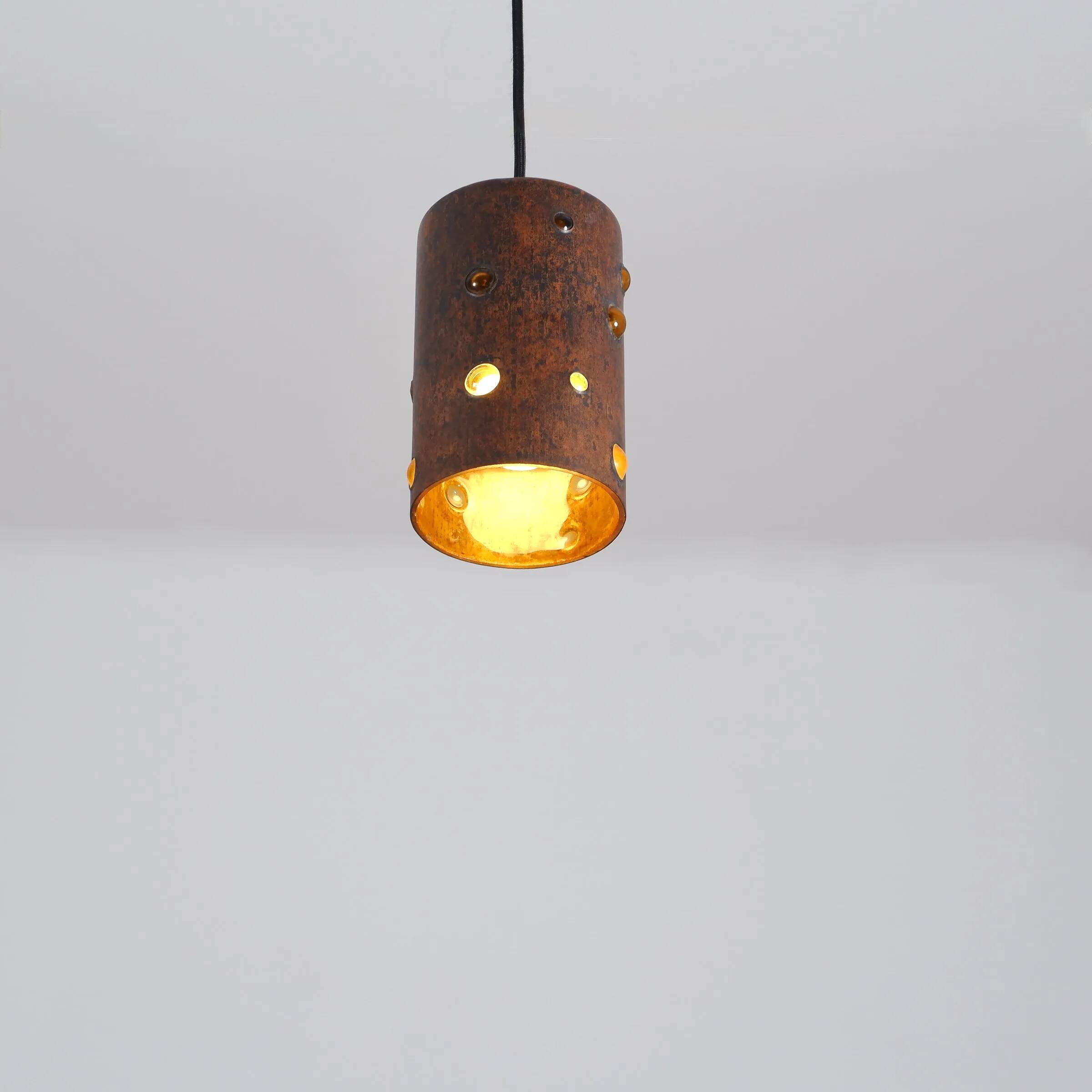 Cylindrical brutalist hanging lamp in copper / glass by Peill & Putzler