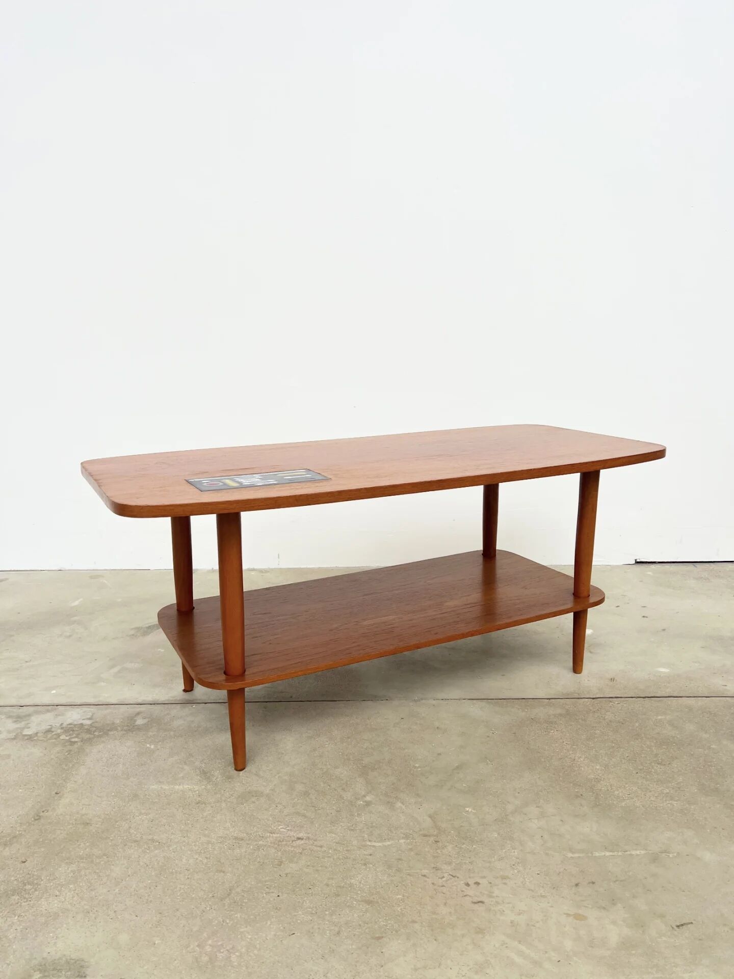 Teak coffee table with double top and ceramic insert — Scandinavian, 1960s