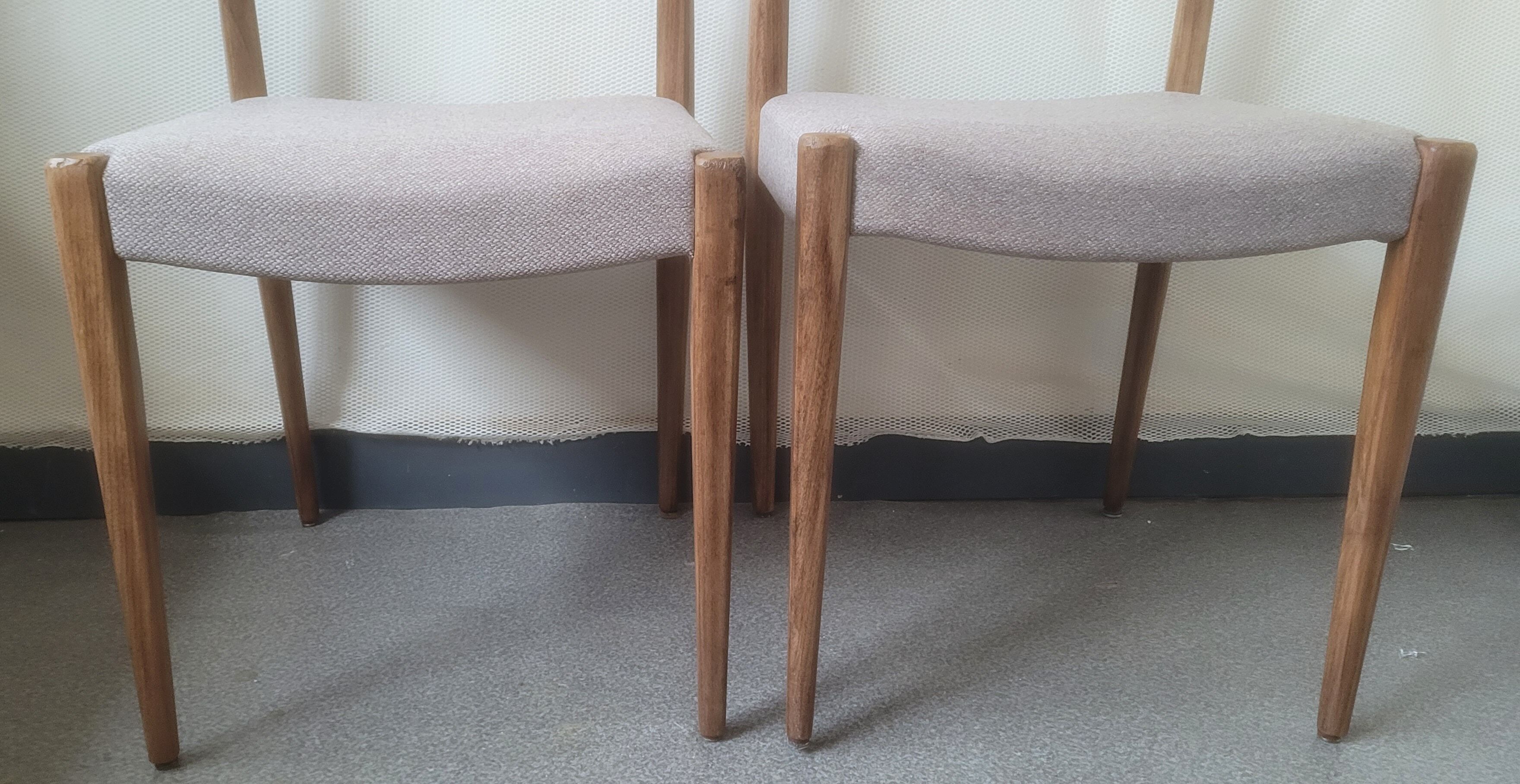 Pair of Scandinavian teak chairs sitting beige gray fabric