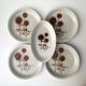 Set of 4 dessert plates and 1 “Thistle” bowl