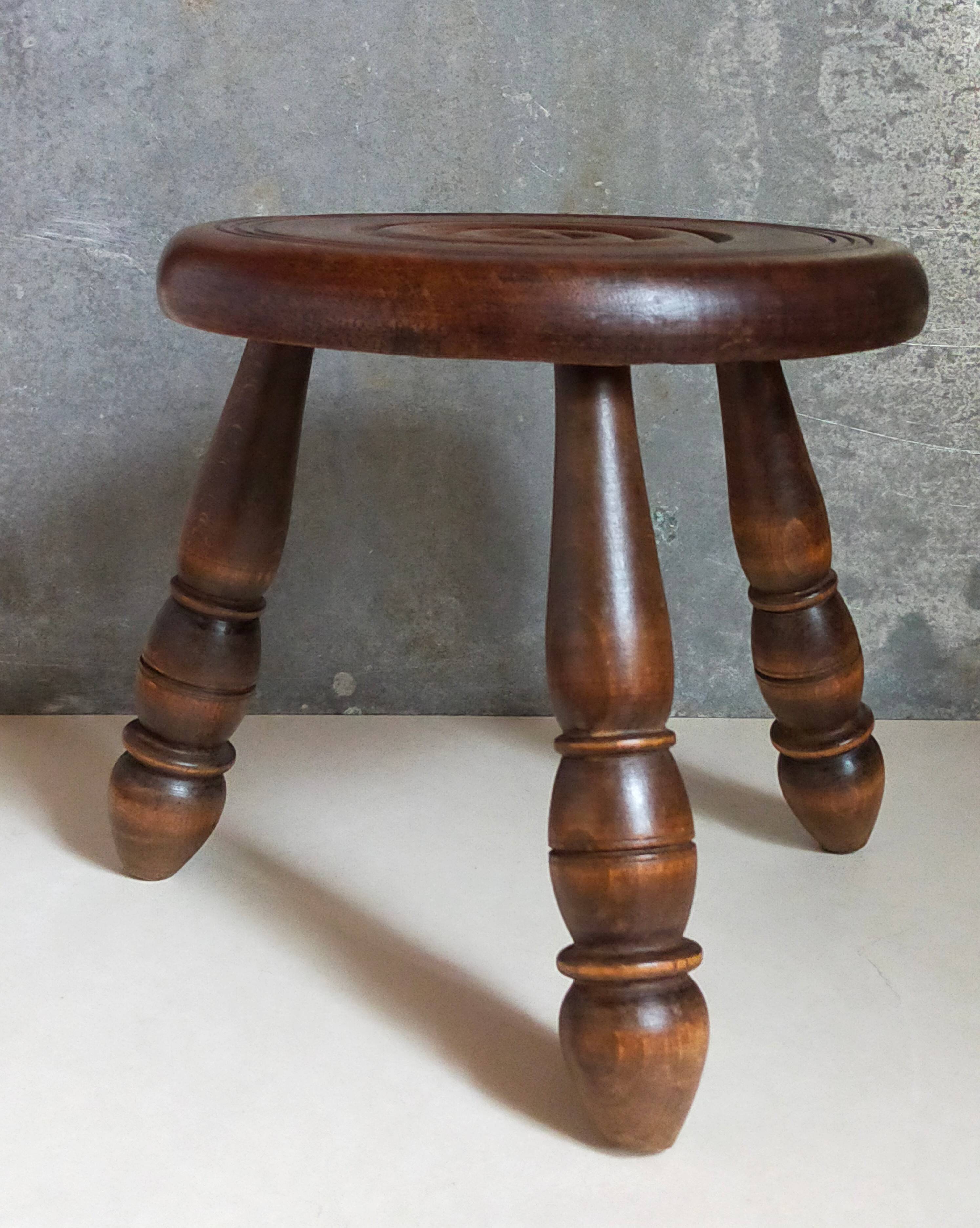 Low tripod stool in vintage turned solid wood