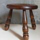 Low tripod stool in vintage turned solid wood