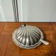 Shell-shaped butter dish in stainless steel