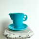 Milk jug on plate