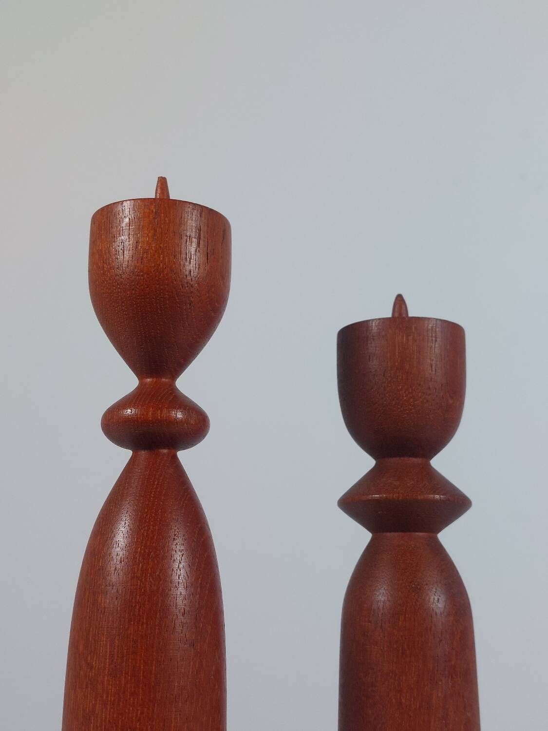 Vintage pair of sculptural teak candlesticks in Scandinavian style.