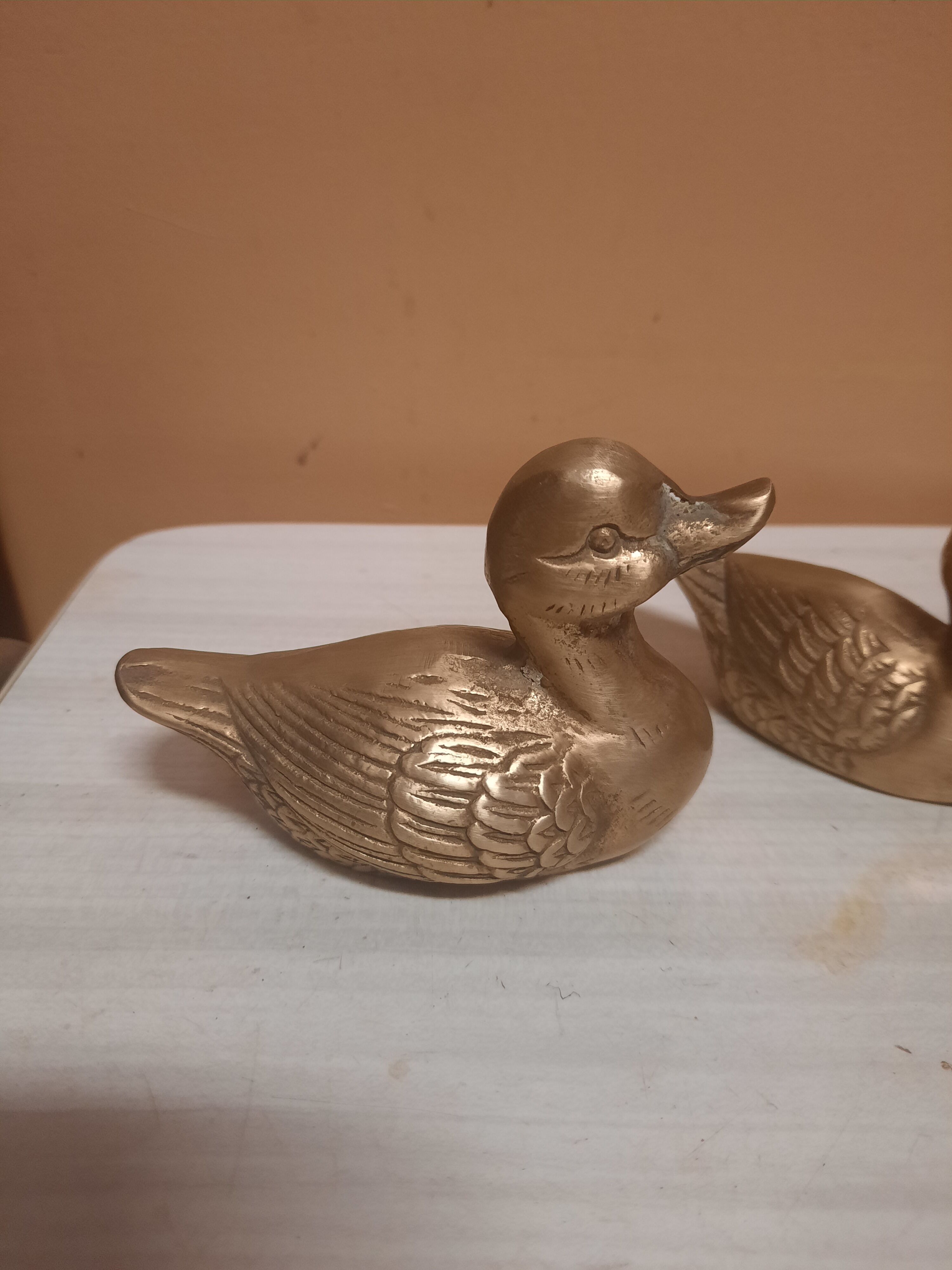 Set of two brass ducks